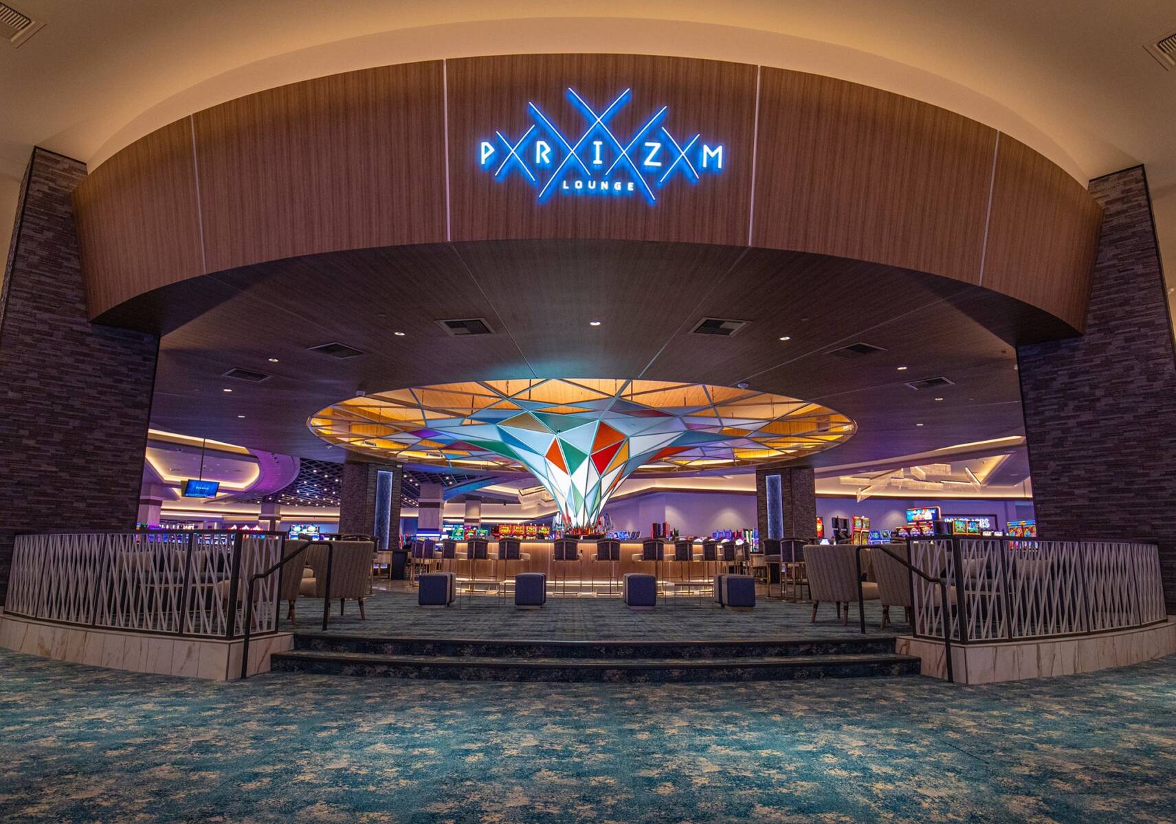 Choctaw Casino & Resort Prize Lounge. This gambling floor bar features blue patterned flooring tile meant to illustrate superior flooring installation capabilities.