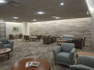Hospital waiting room featuring neutral carpet tile flooring with leaf pattern. This image is meant to demonstrate expertise in carpet tile healthcare flooring.