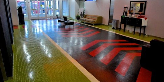 Racetrack flooring of a red path surrounded by green margins.